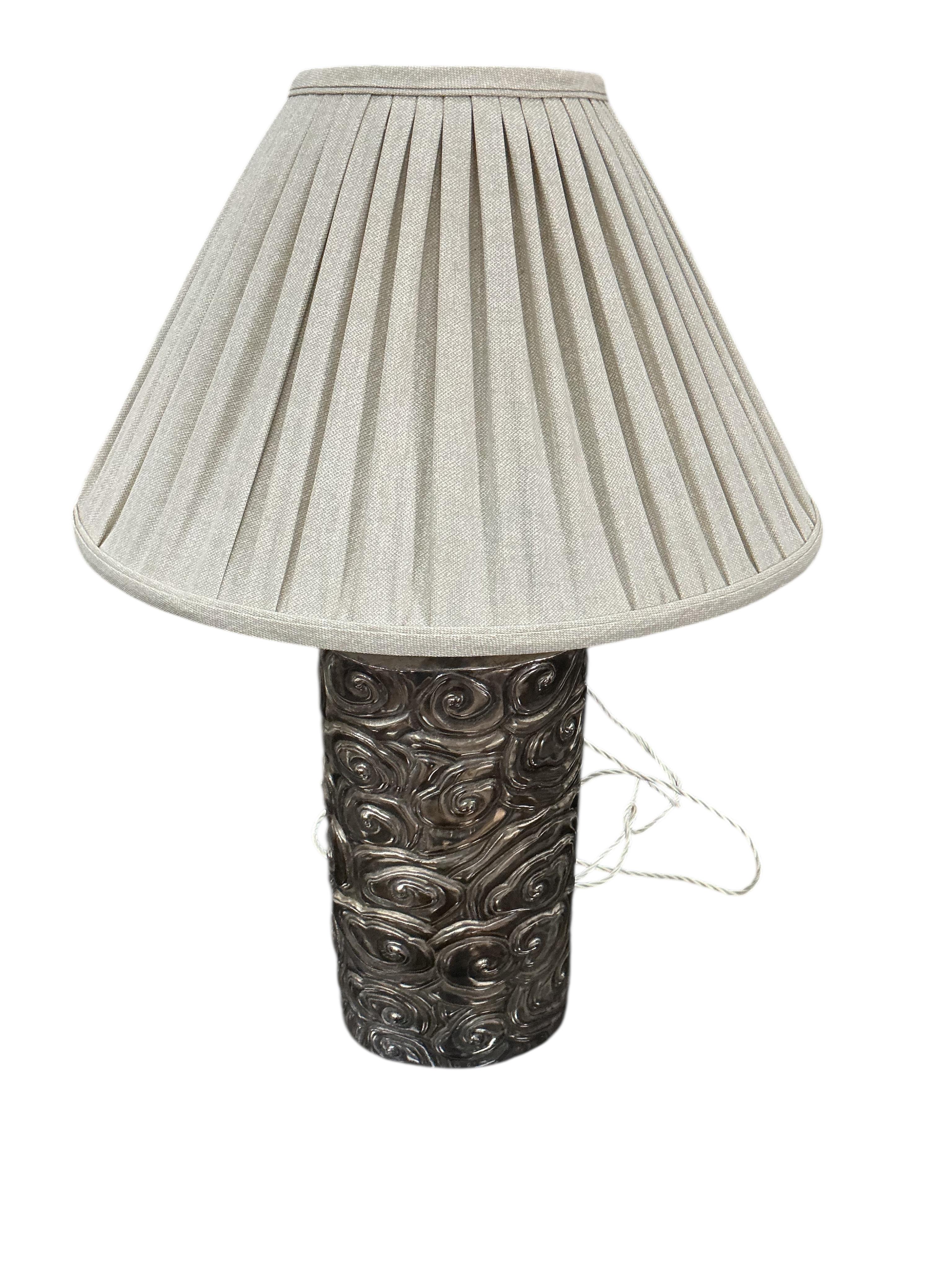 A pair of Robert Kuo Collection McGuire repousse table lamps with quilted shades, height 78cm